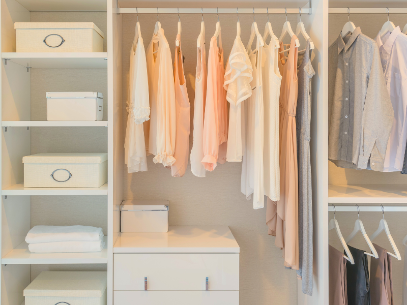 organized-closet-with-neatly-aligned-womens-clothing