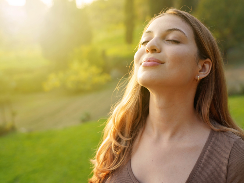 woman outside breathing fresh air