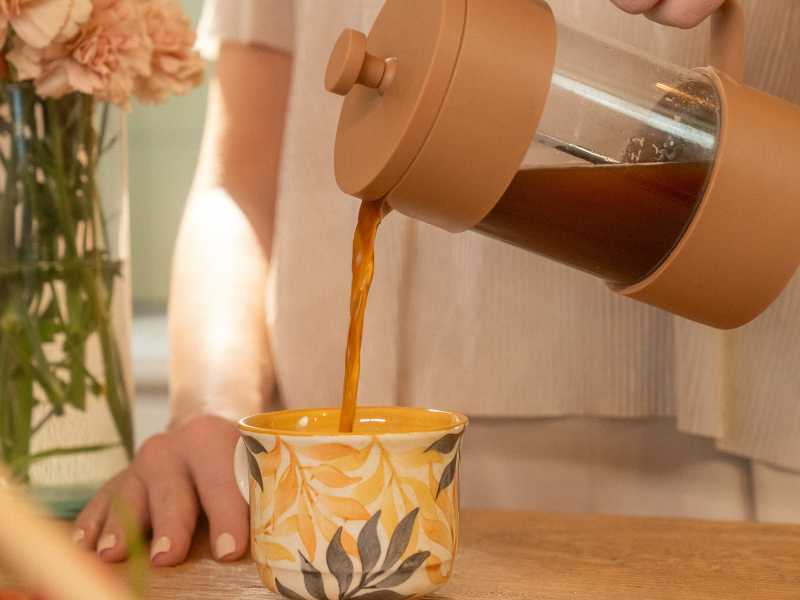 woman pouring coffee