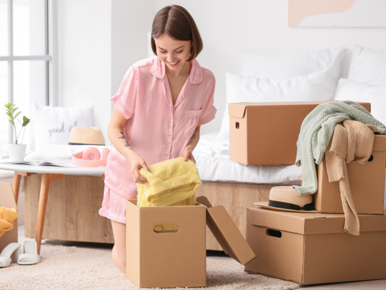 woman sorting clothes and donations